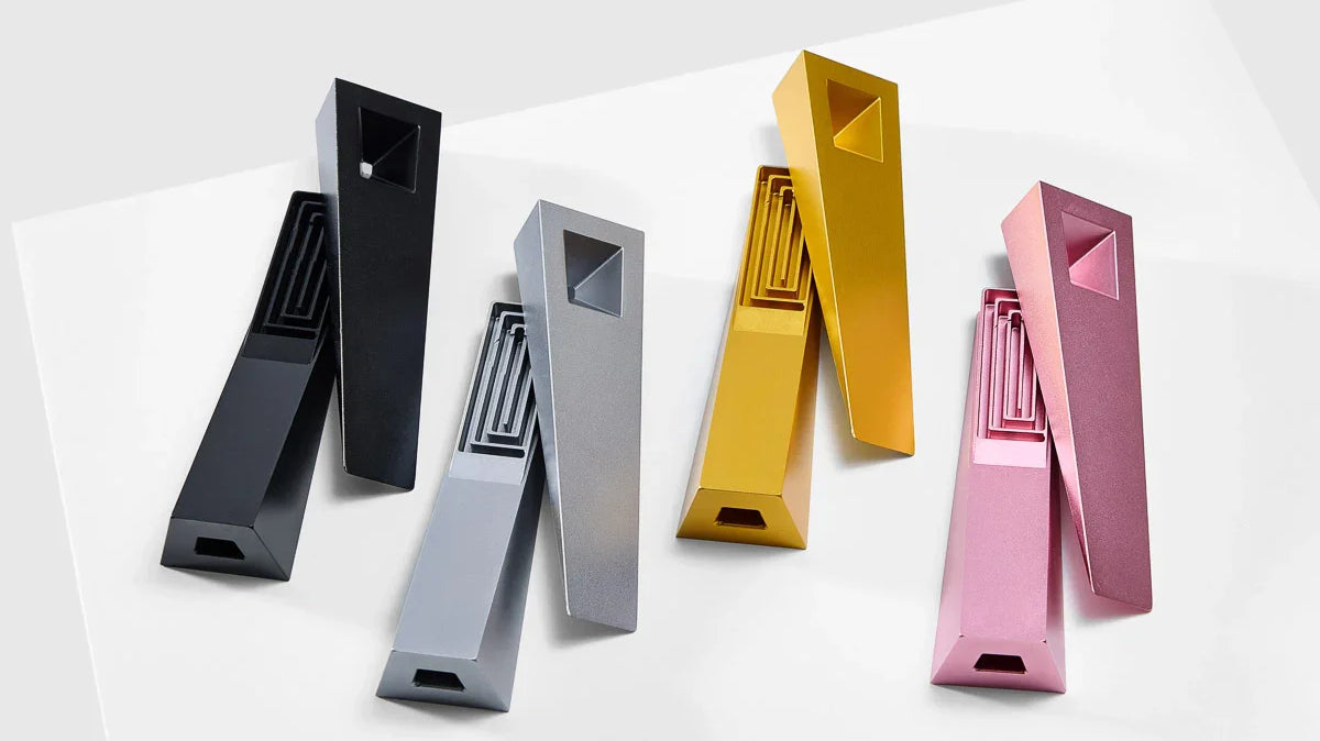 a lineup of modern Tempest smoking pipes with the lids off showing the internal cooling pathways