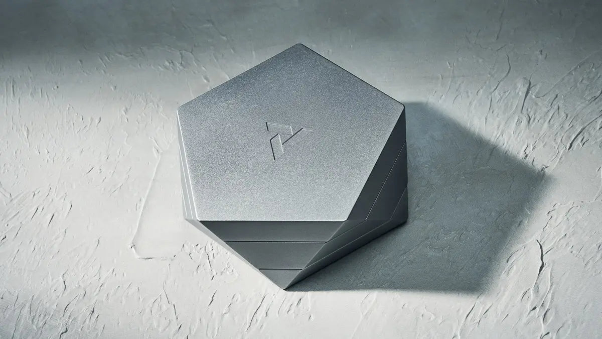 a designer metal ashtray with a lid